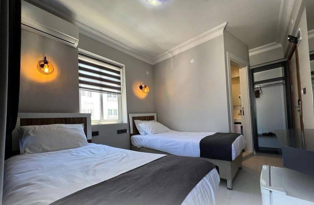 Twin room with warm lighting